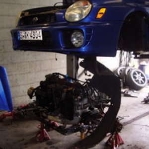 Getting ready to drop the shell down on the STi powerplant